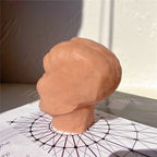 Rear three-quarter view of the sculpted head