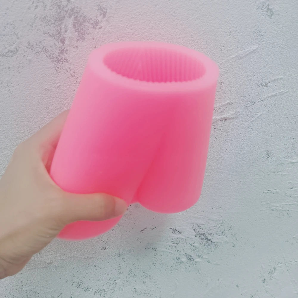 Pink V letter silicone mold held in one hand