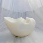 White abstract double-opening vessel casting viewed in profile