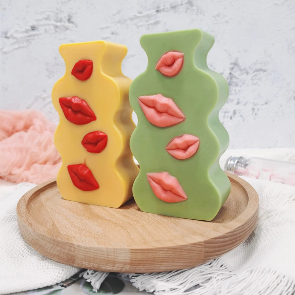 Green and yellow lips relief plaques on a tray