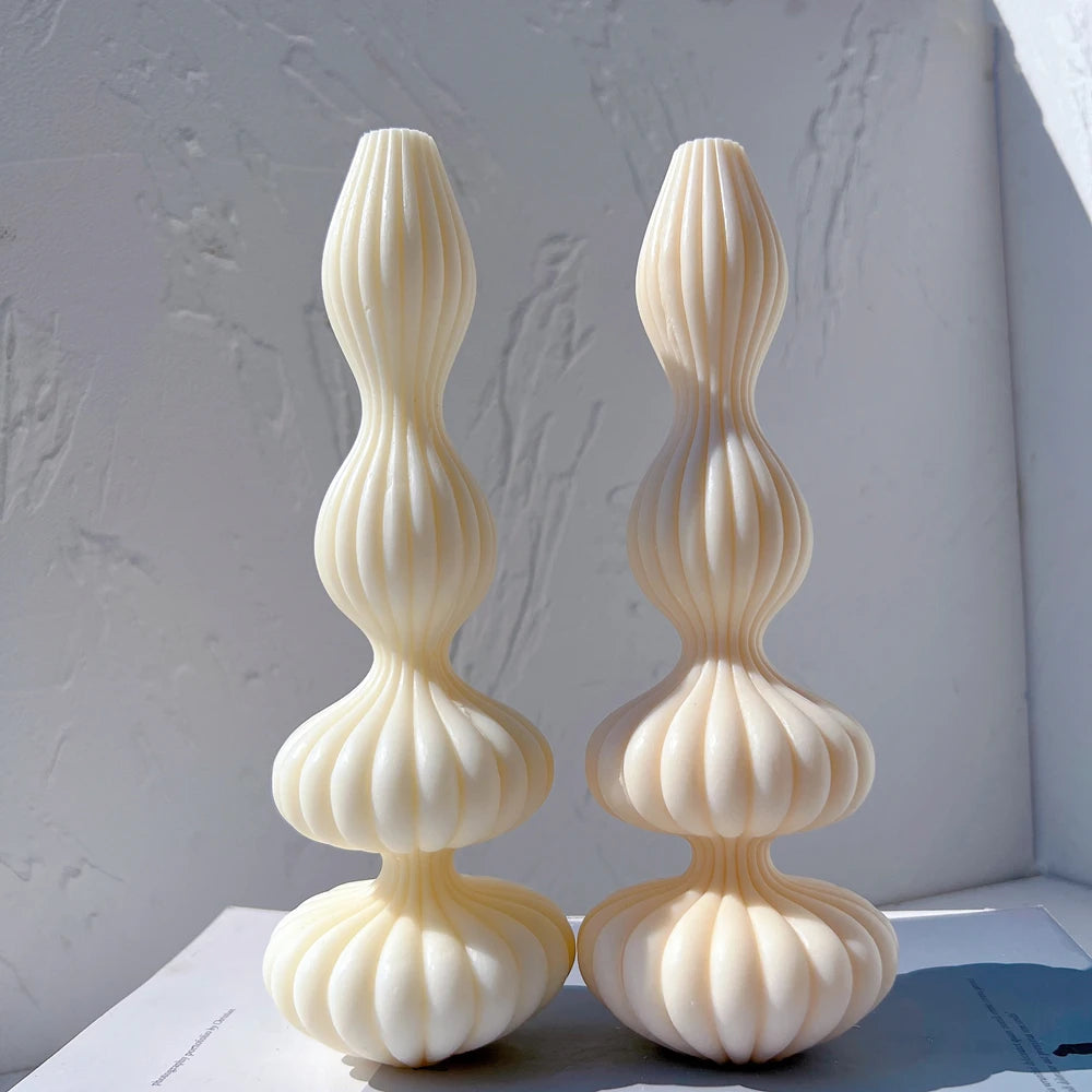 Pair of tall stacked ribbed pillar candles