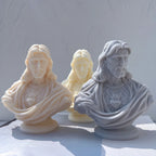 Three Sacred Heart Jesus bust candle castings on rounded pedestals