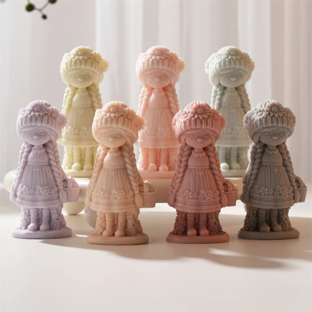 Flower girl figures in several pastel colors arranged on standing bases