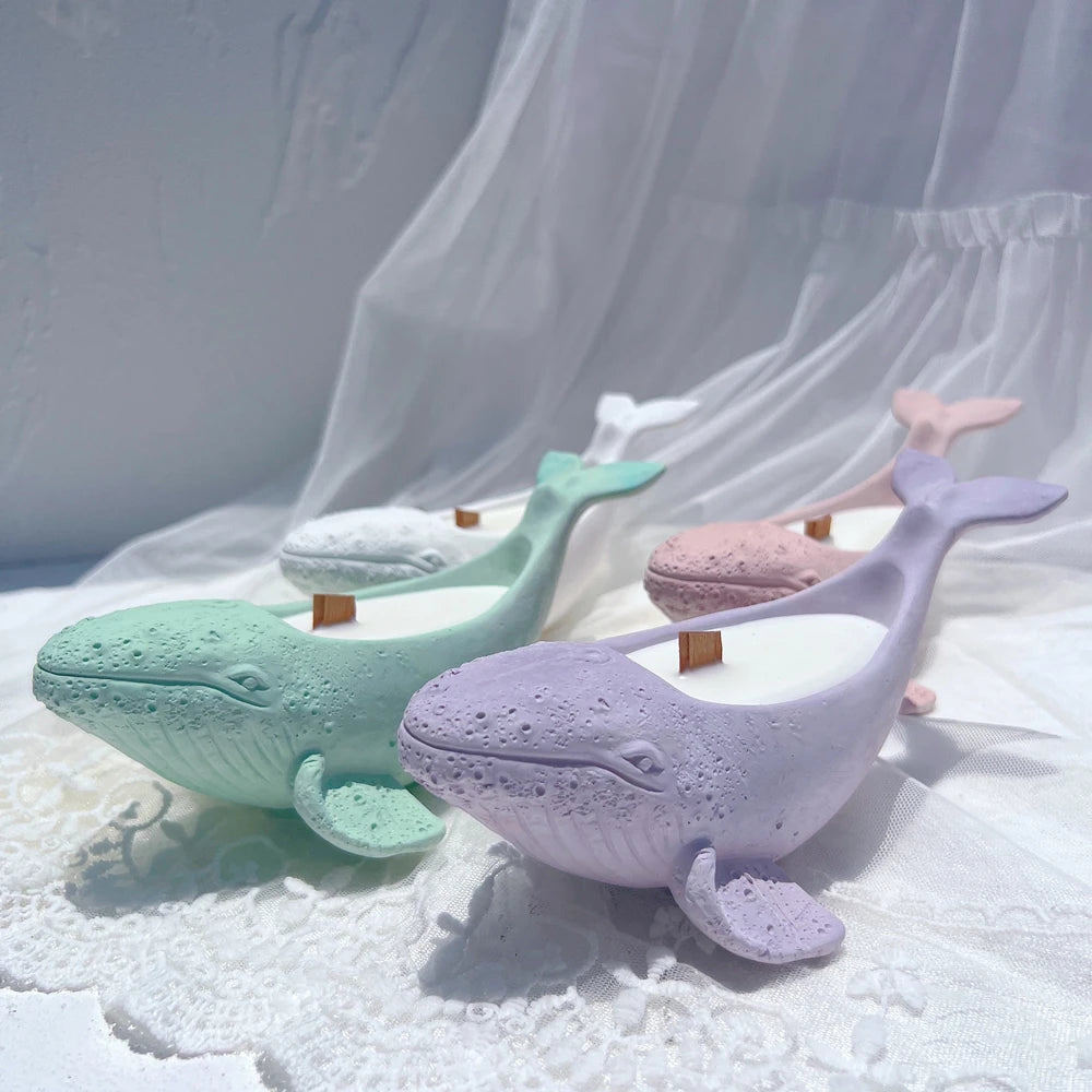 Whale-shaped holders with recessed backs and raised tails