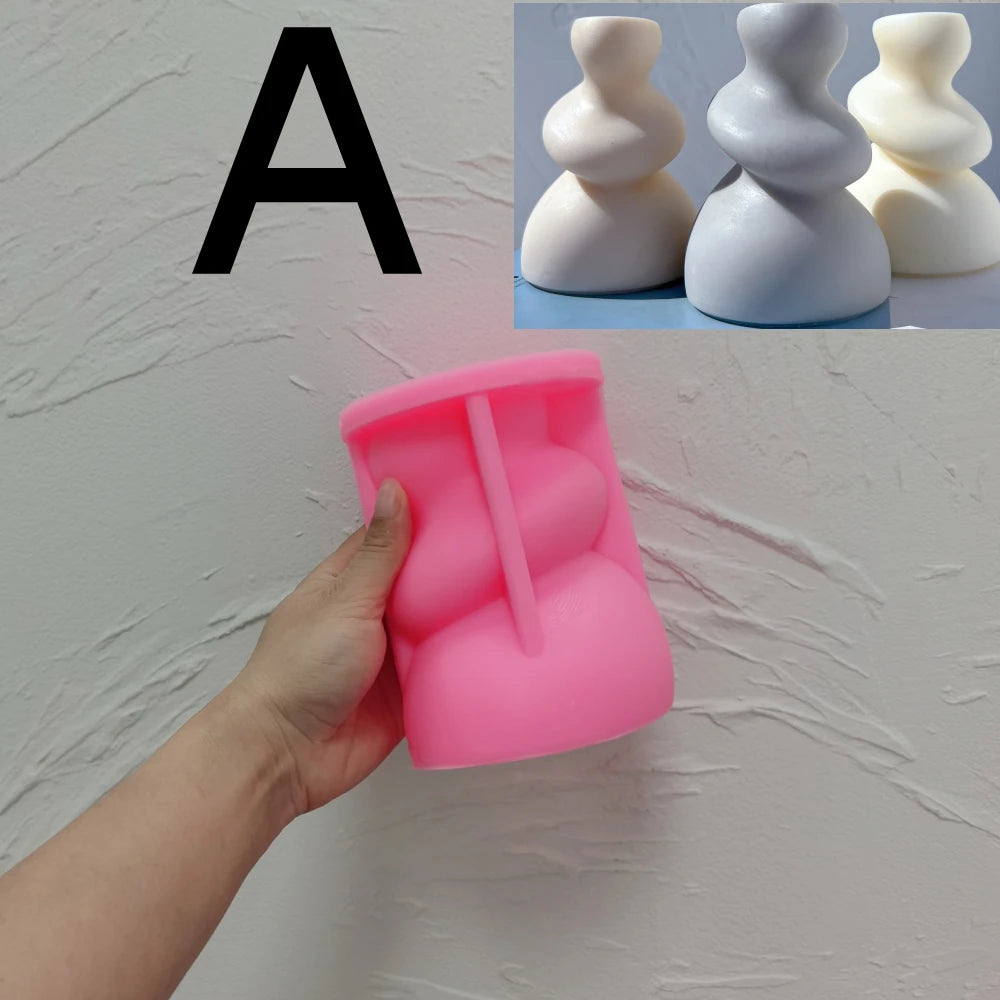 Pink silicone Soft Twist A mold with its compact curved body