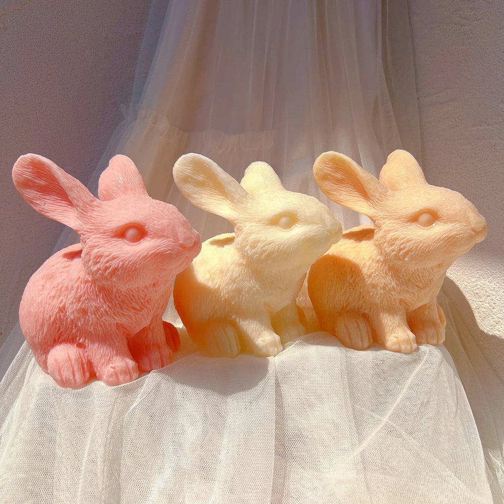 Seated rabbit trio facing different directions