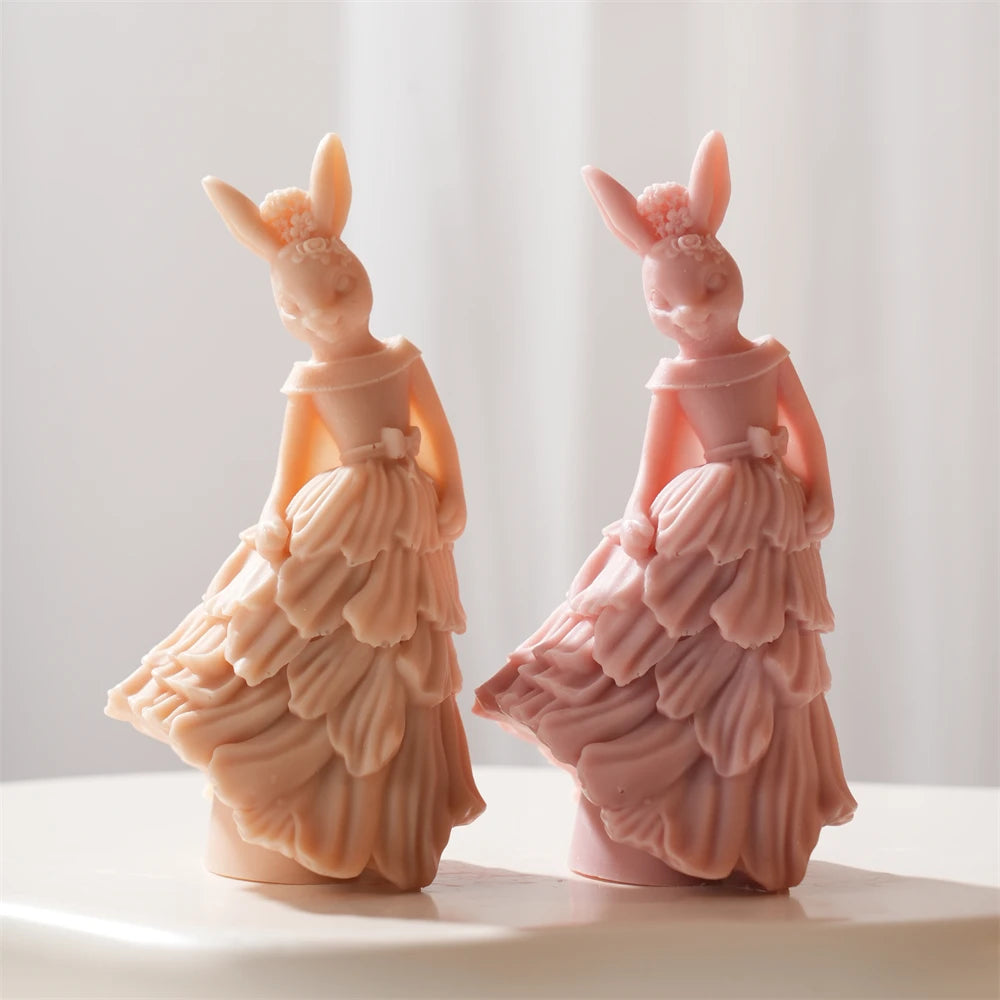 Rabbit figures wearing tiered ruffle gowns