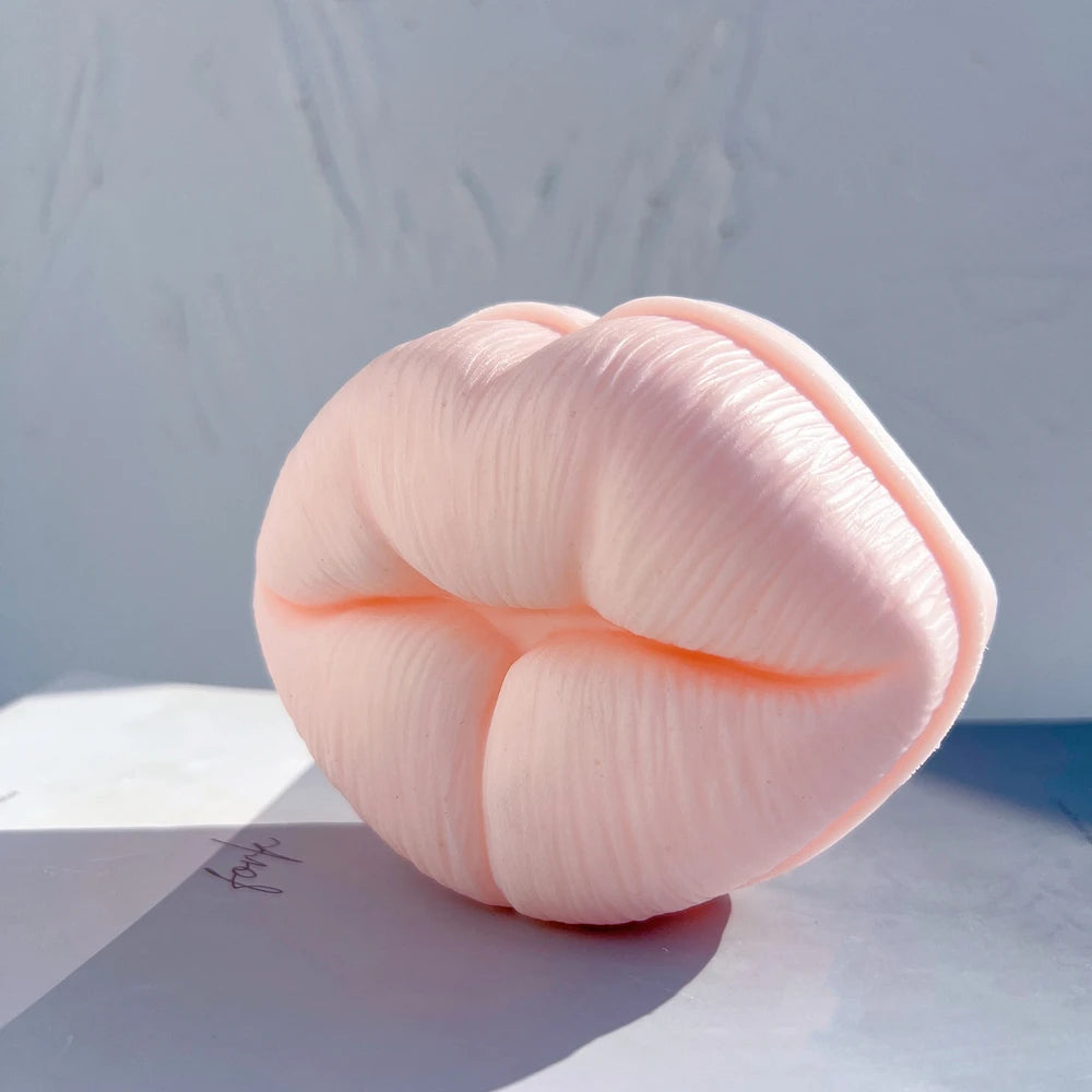 Angled pink lip casting with a defined mouth opening