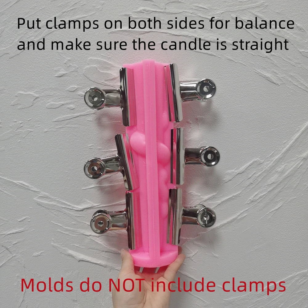 Pink snake taper mold supported with clamps and a notice that clamps are not included