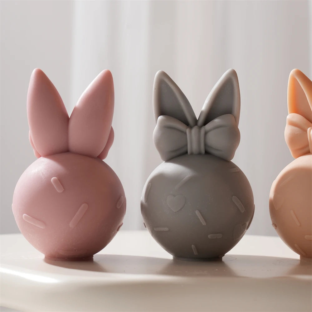 Plain ear backs beside bow-decorated bunny fronts