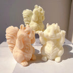Side view of squirrel figures with full curved tails
