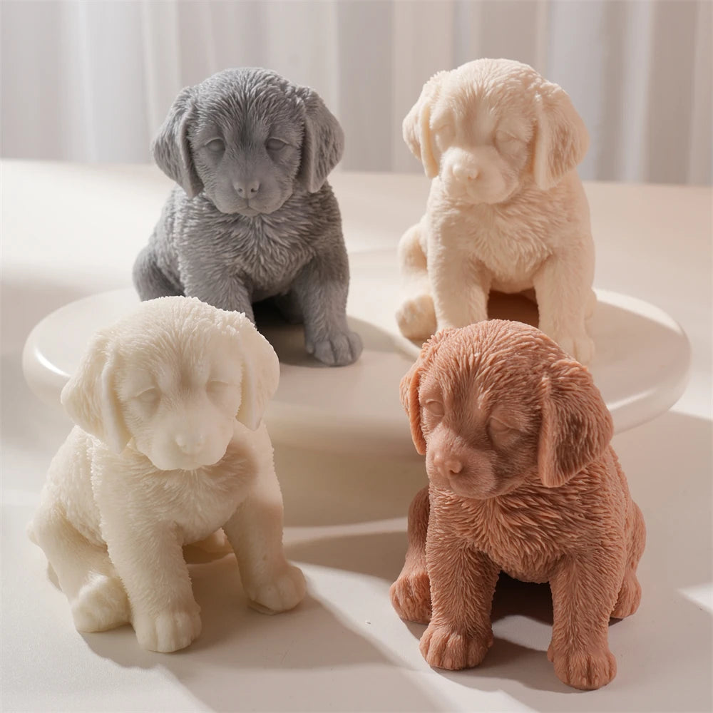 Four puppy castings in neutral colors with detailed fur and relaxed seated posture