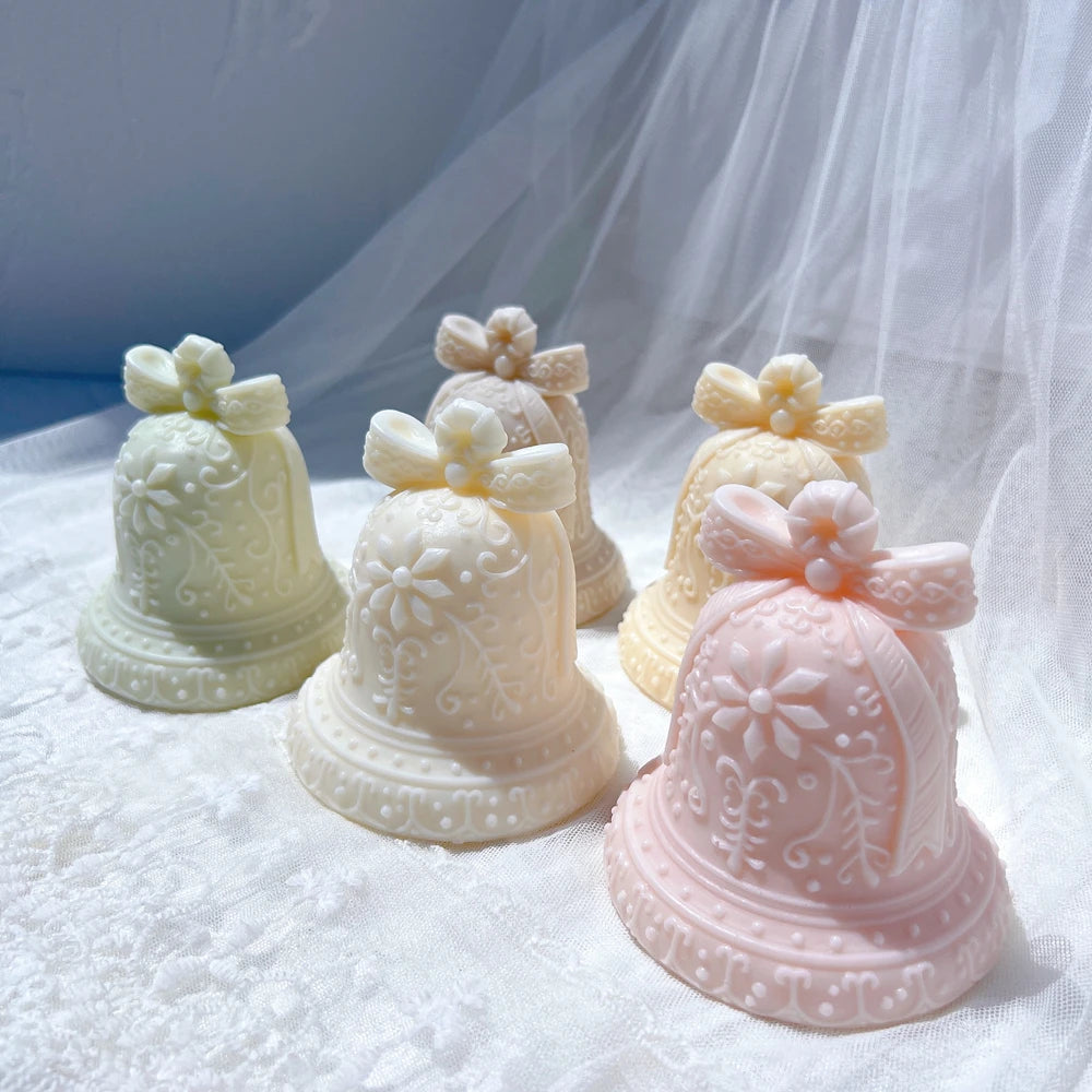 Holiday bell wax castings in light neutral colors