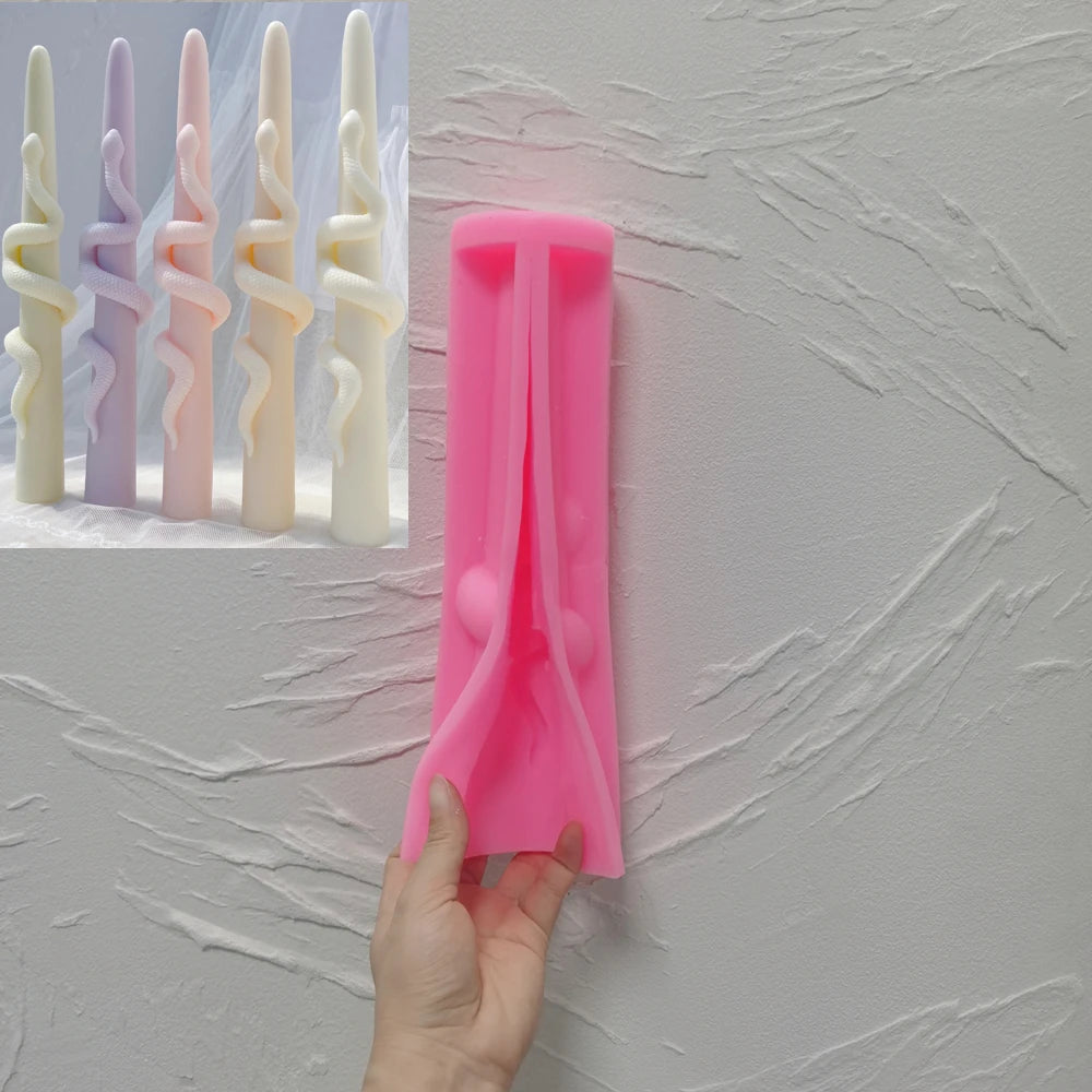 Pink snake-wrapped taper silicone mold held in one hand