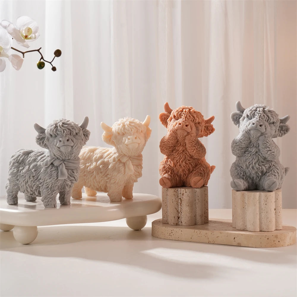 Group of seated and standing shaggy cow castings