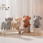 Group of seated and standing shaggy cow castings