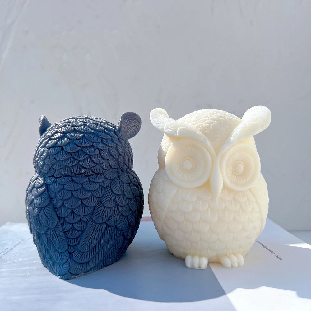 Rear feather detail of blue owl beside cream front view