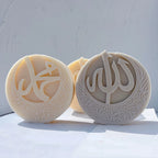 Two circular calligraphy castings with patterned crescent bases