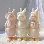 Peach, cream and yellow rabbit figures with apron detail