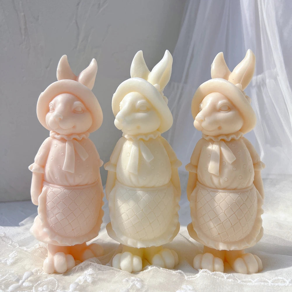 Peach, cream and yellow rabbit figures with apron detail