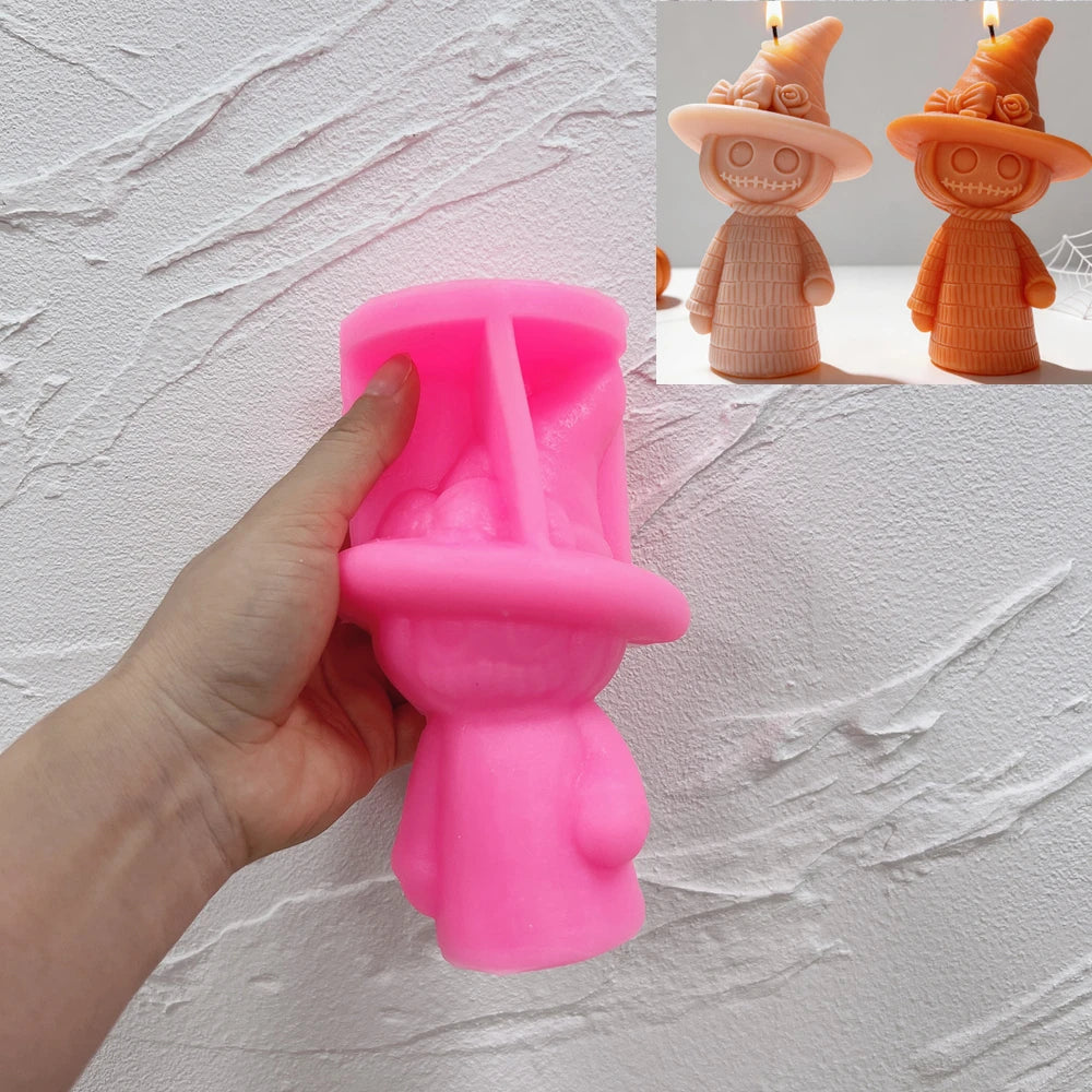 Pink textured-witch silicone candle mold held in one hand
