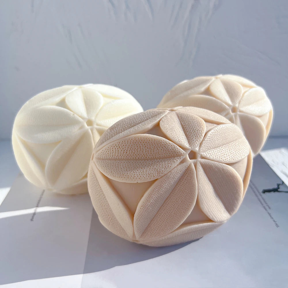 Angled view of rounded cubes showing their petal-covered faces