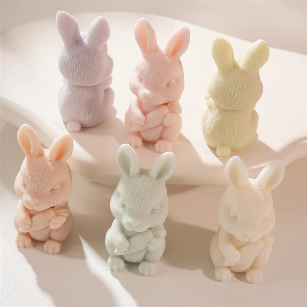 Standing rabbit candle figures seen from front and side