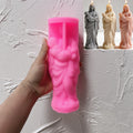 Pink silicone mother-and-baby figure mold beside finished examples