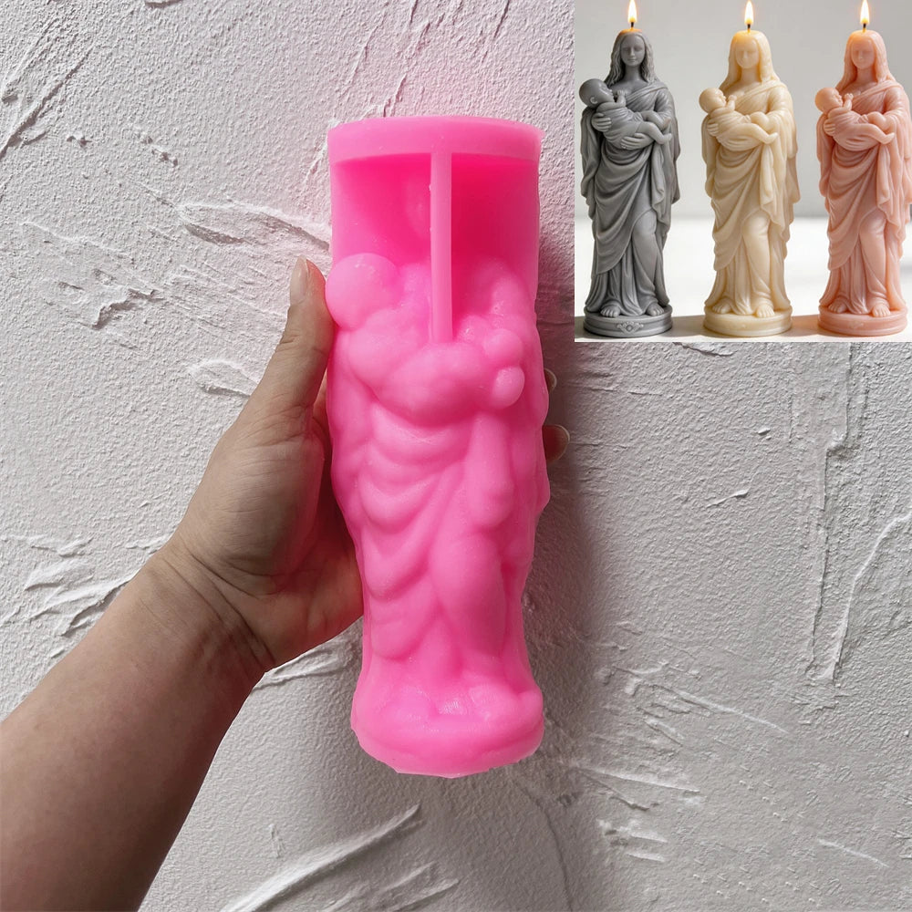Pink silicone mother-and-baby figure mold beside finished examples