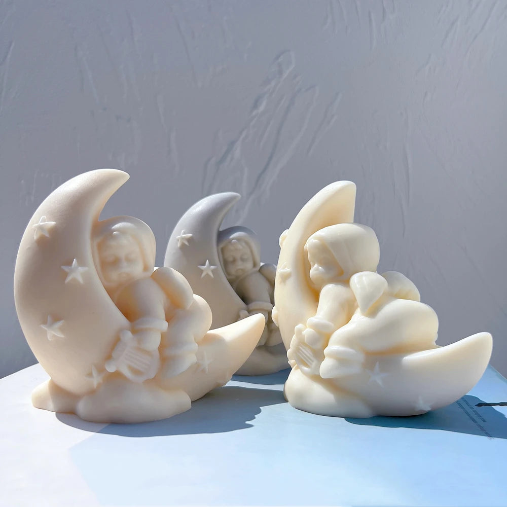 Angel figures seated inside star-decorated crescent moons