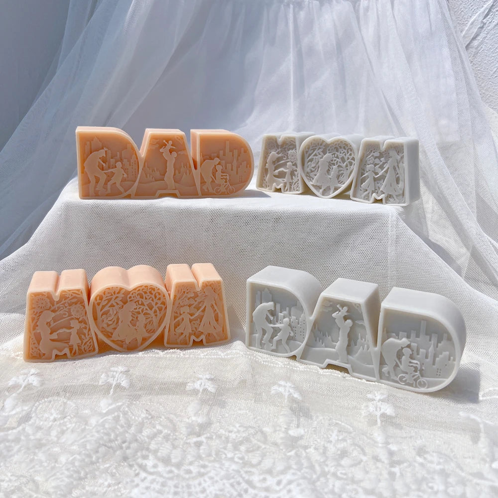 DAD block-letter and heart-centered MOM castings with family relief details