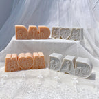 DAD block-letter and heart-centered MOM castings with family relief details