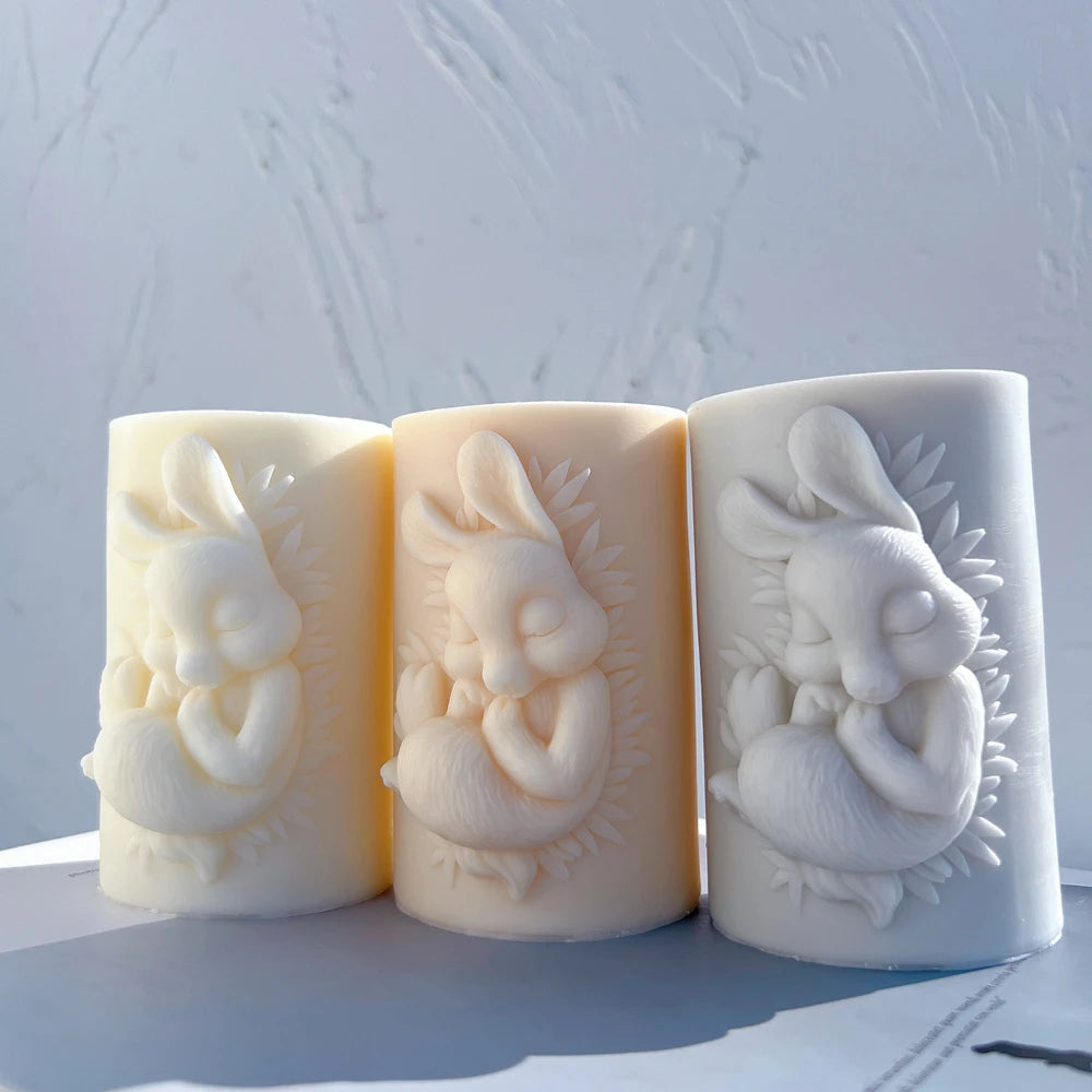 Three bunny cameo pillars showing leafy oval frames