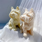 Gold and cream seated terrier candles viewed at an angle
