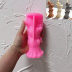 Pink silicone stacked ghost mold held in one hand