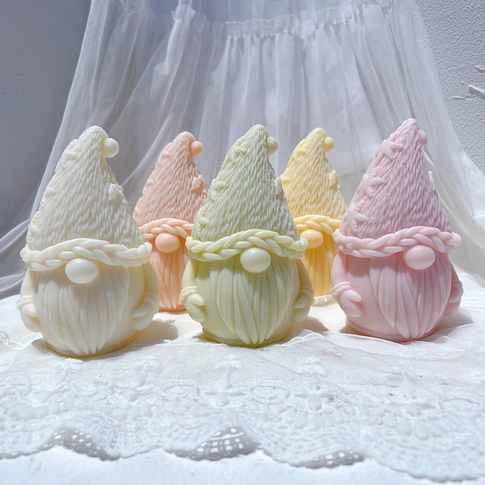 Pastel rounded gnome castings with tall knit hats and long beards