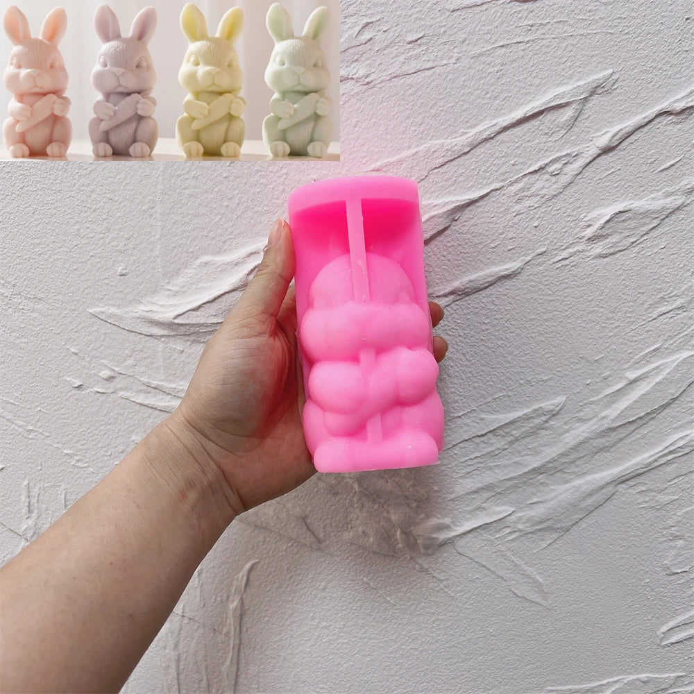 Pink silicone mold for Easter rabbit holding a carrot