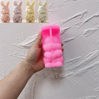 Pink silicone mold for Easter rabbit holding a carrot