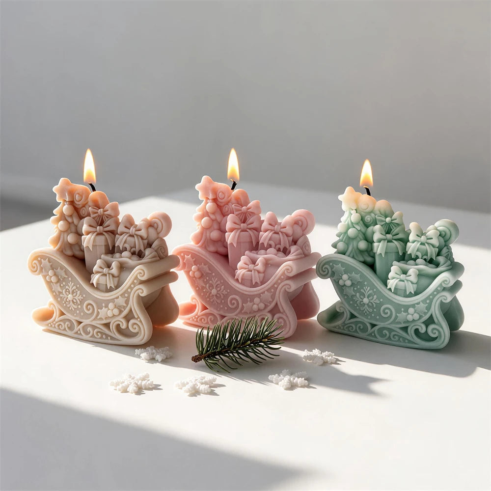 Four gift sleigh castings with raised bows and holiday detail