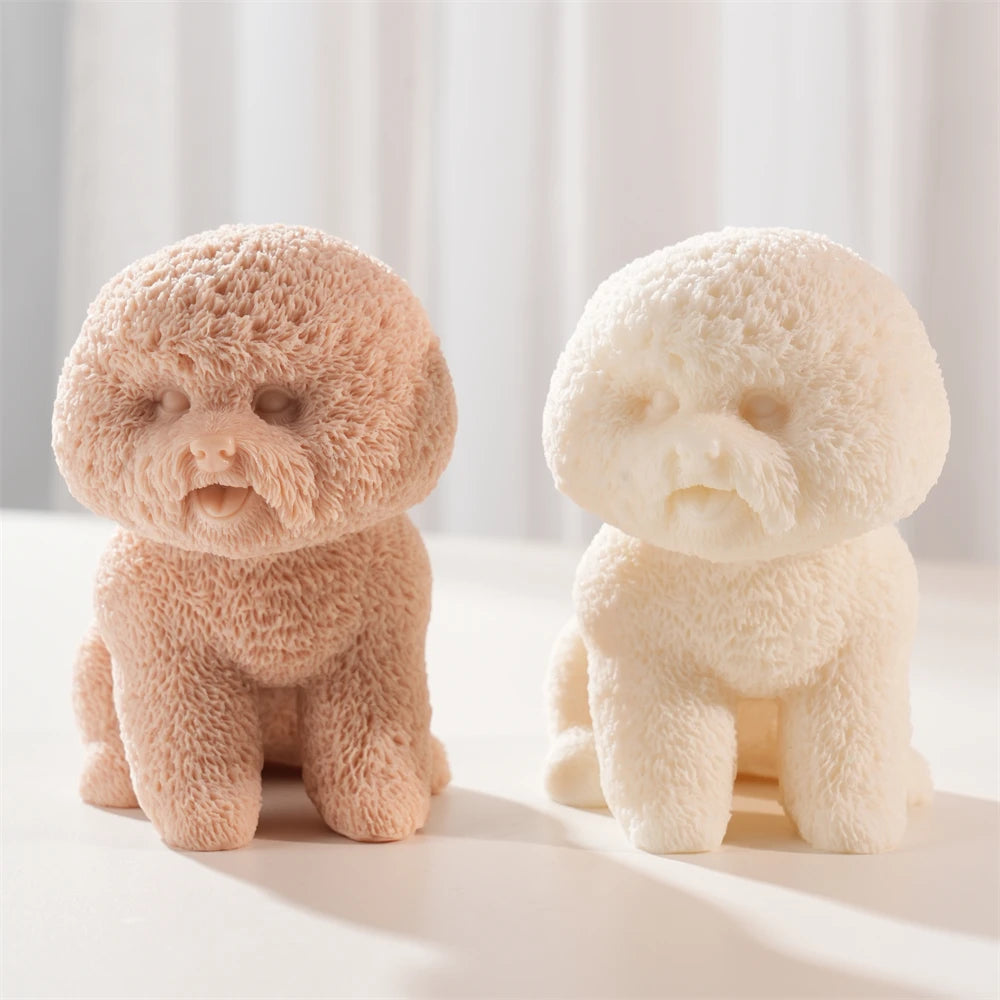 Front view of two round-head puppy castings with curly fur texture