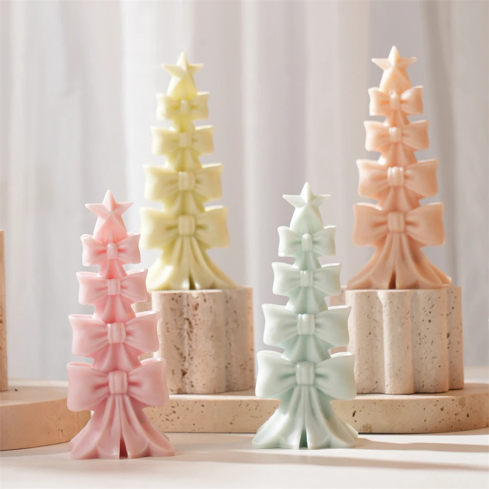 Group of bow-stack tree candles arranged at different heights
