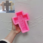 Pink silicone cross mold with angel and nativity relief cavity