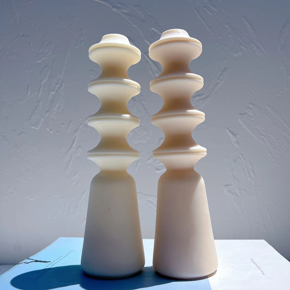 Cream and peach stacked-disc pillar castings with tapered bases