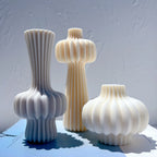Lower-bulb, top-bulb and compact round samples on a blue surface