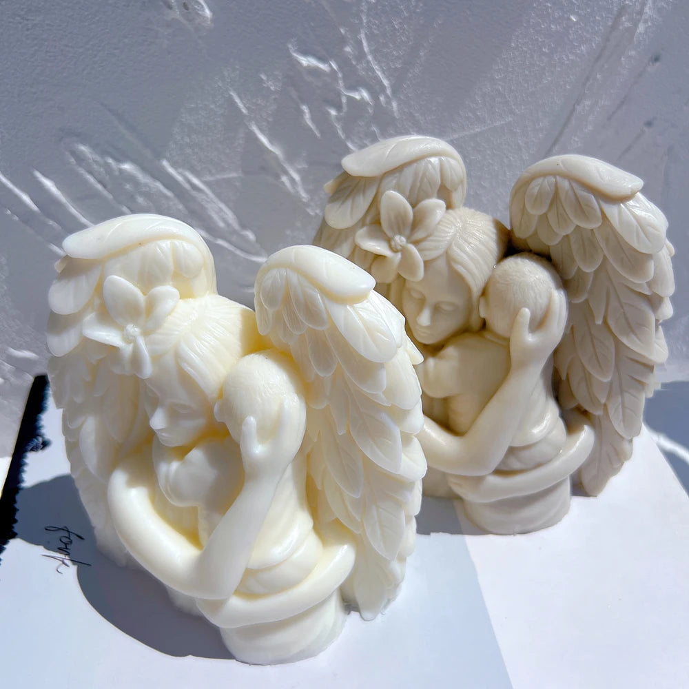 Overhead view of mother-and-child figures within wings