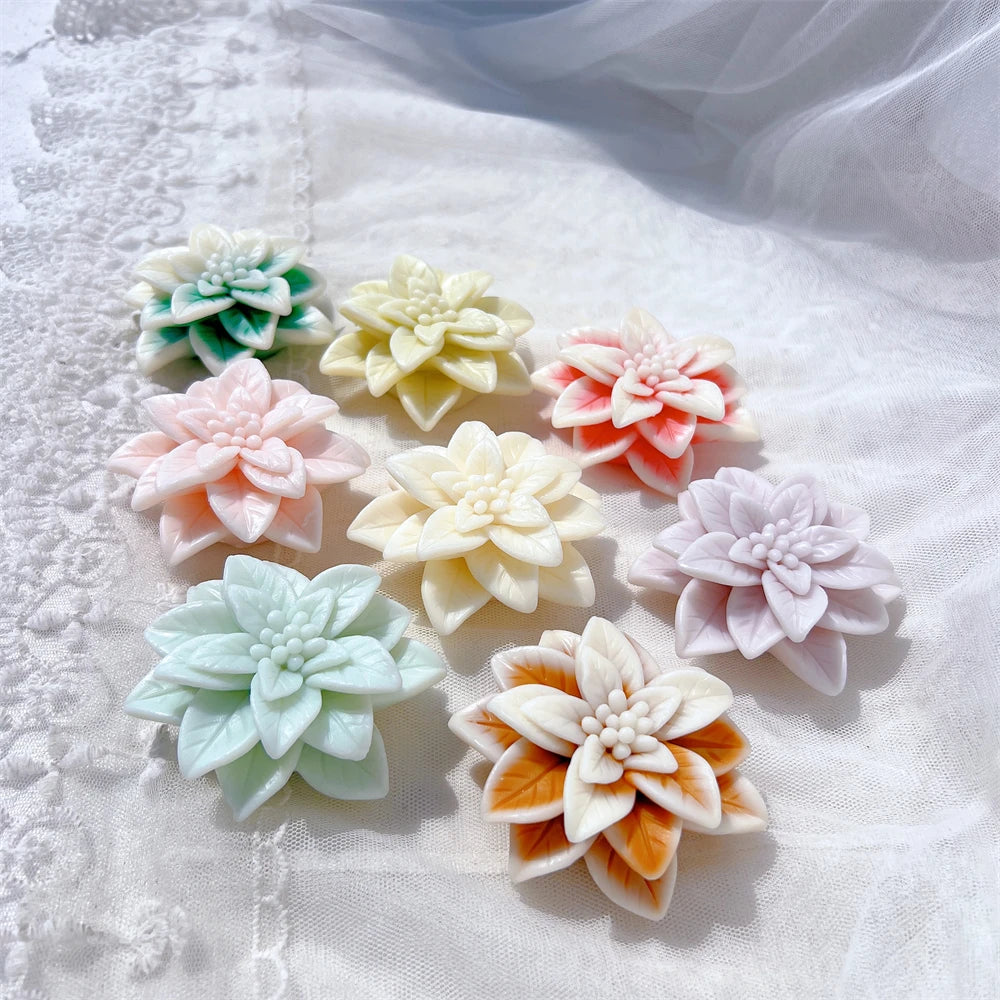 Group of layered flower castings in green pink cream and orange