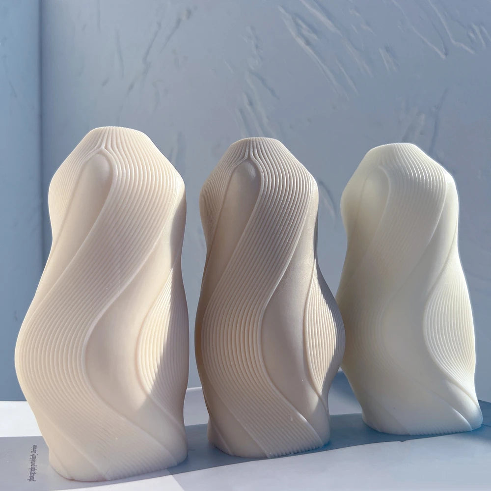 Three flowing wave castings with fine curved ribs