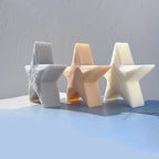 Three star candle castings viewed at an angle to show their depth