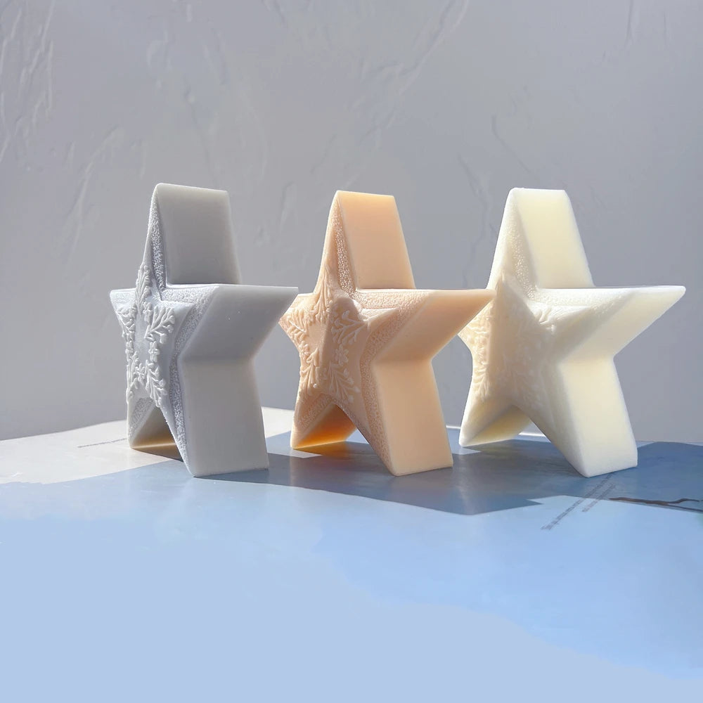 Three star candle castings viewed at an angle to show their depth