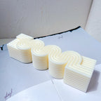 Serpentine casting laid flat to show repeated curves and square ends